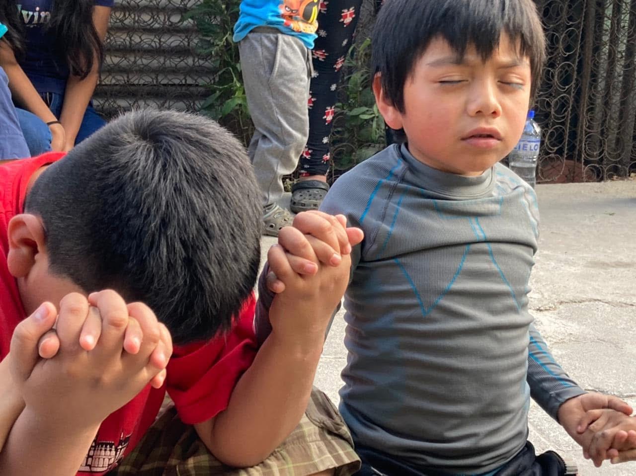 Children praying together